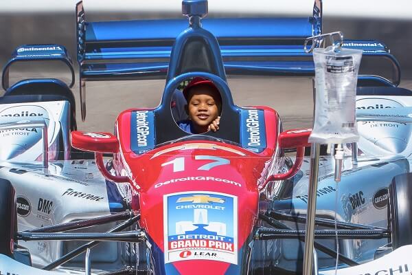 Kid inside racecar