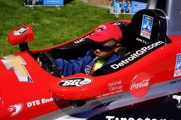 Kid driving a racecar